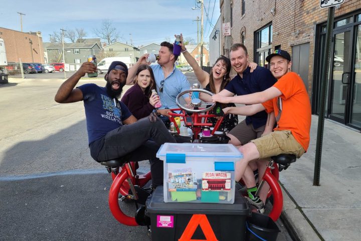 Gregory Gandy et al. sitting on a motorcycle