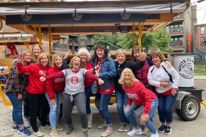 Patti Hansen et al. standing in front of a building