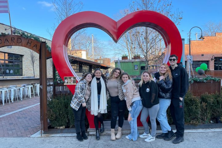 a group of people standing in front of a building