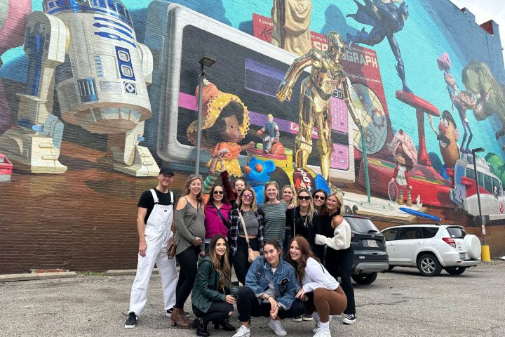 a group of people standing in front of a building
