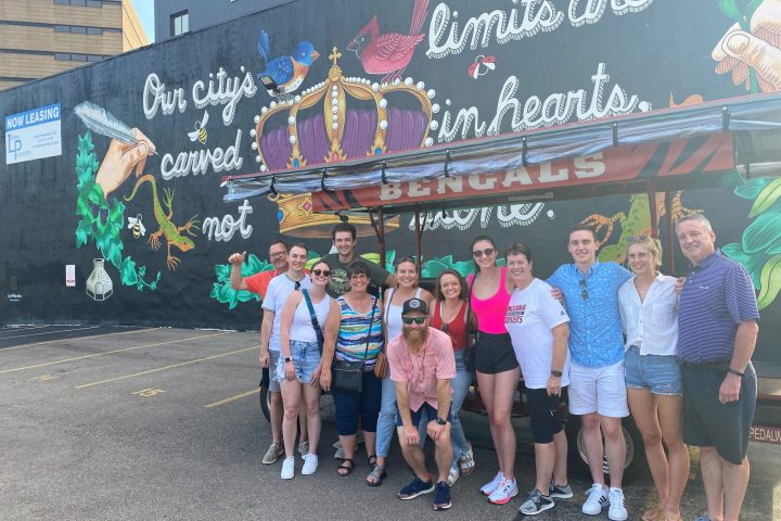 a group of people standing in front of a crowd posing for the camera