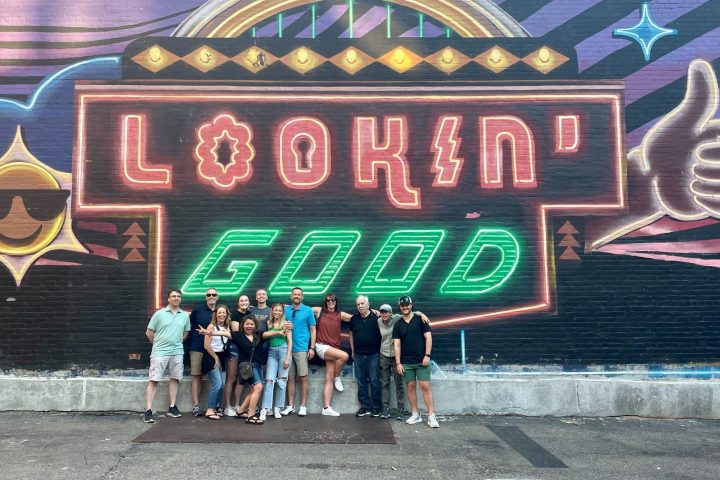a group of people standing in front of a building