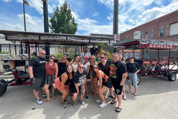 a group of people standing in a parking lot