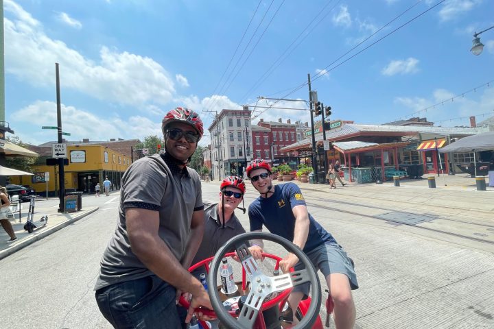 a man holding a bicycle