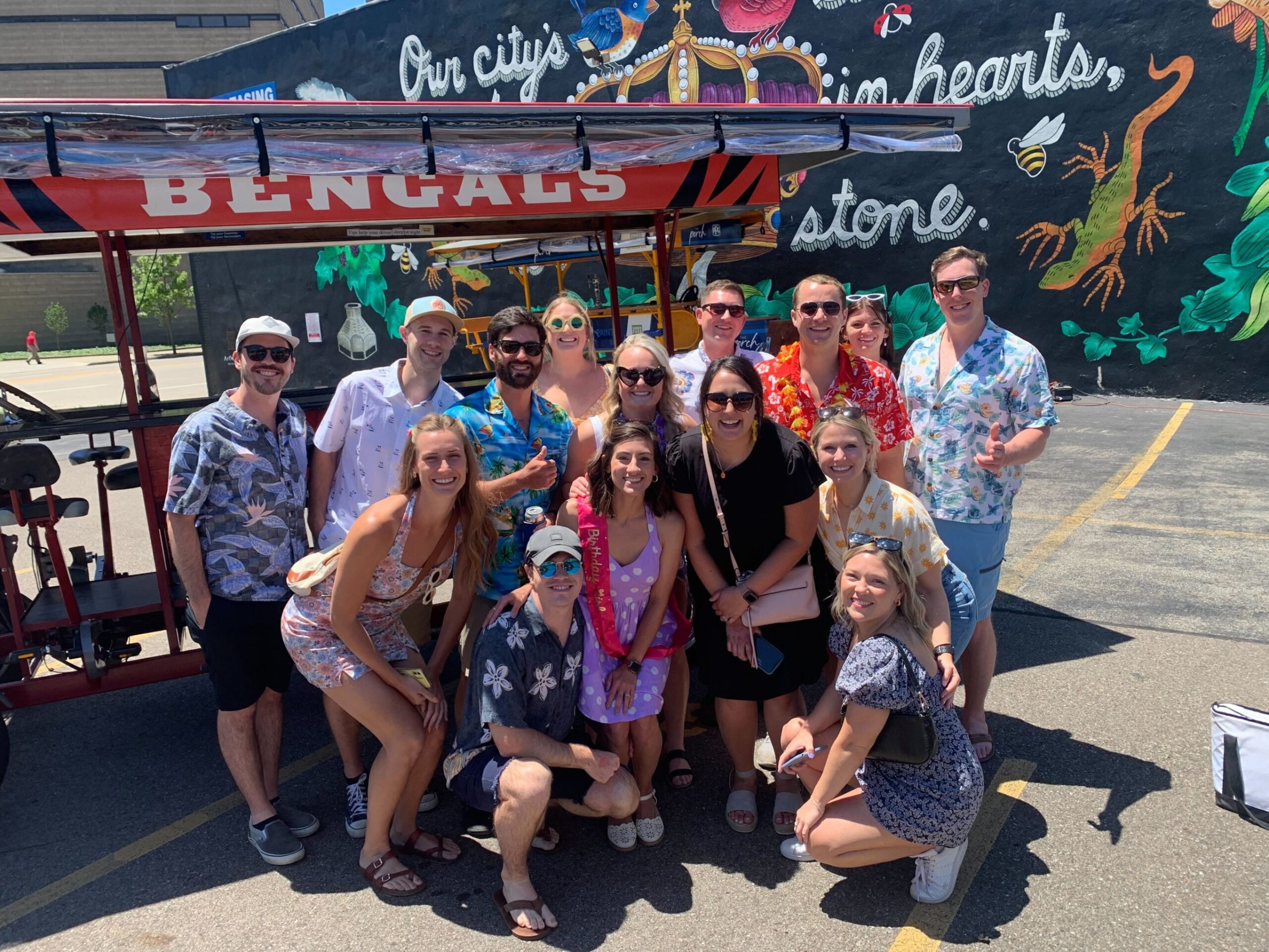 a group of people standing in front of a crowd posing for the camera