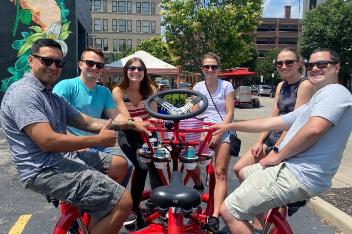 a group of people sitting in a parking lot