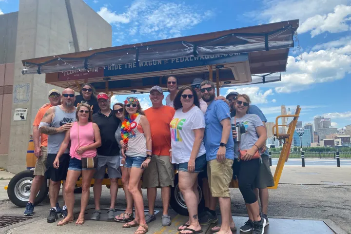a group of people standing in front of a crowd posing for the camera