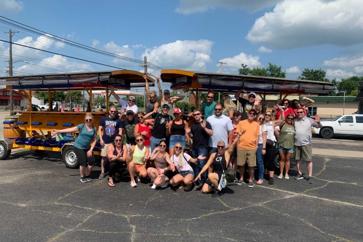 a group of people standing in a parking lot