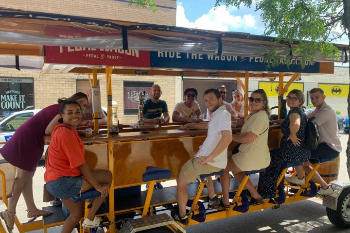 a group of people riding on the back of a truck