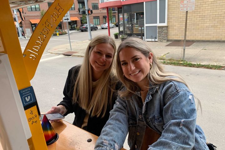 a woman standing in front of a building