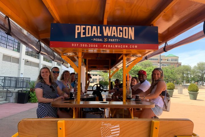 a group of people standing in front of a store