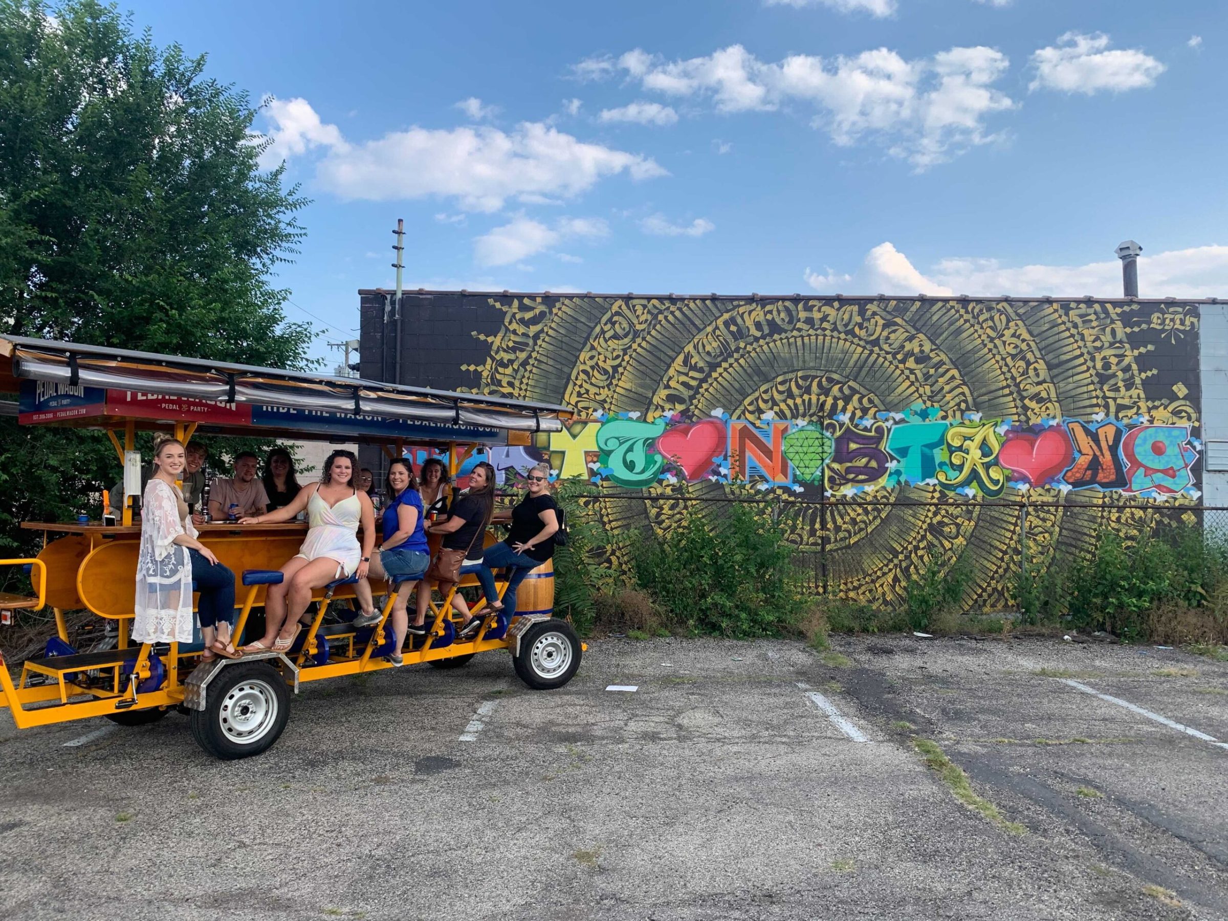 a group of people riding on the back of a truck