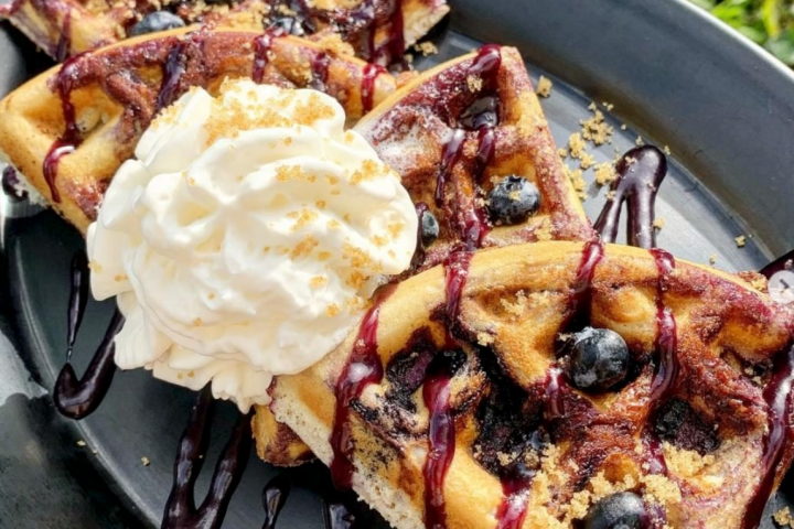 a pizza sitting on top of a plate of food