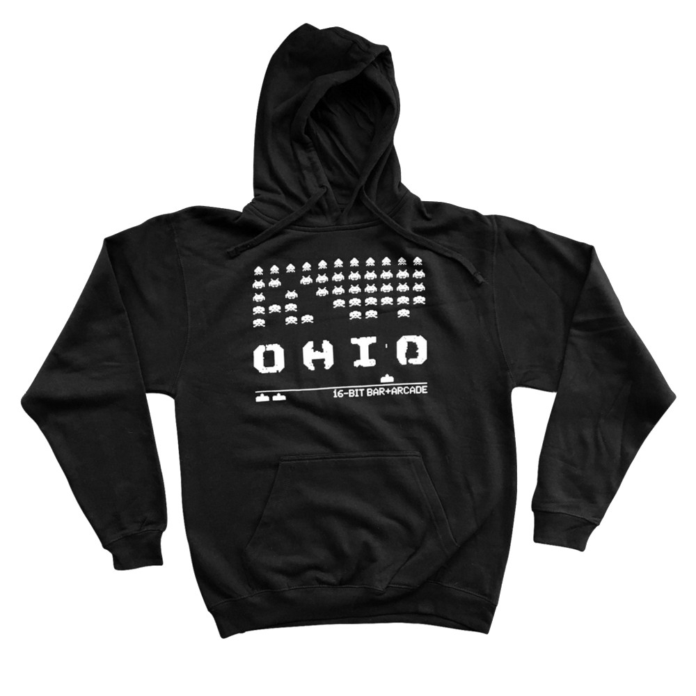 a man that is standing in the dark