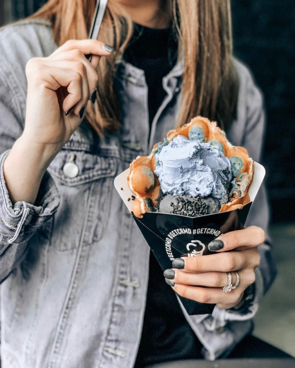 a woman holding ice cream