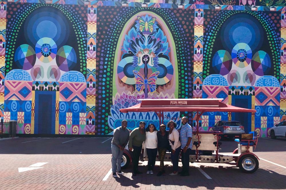 a group of people standing in front of a building