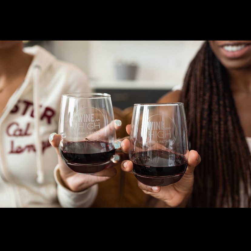 a person holding a wine glass