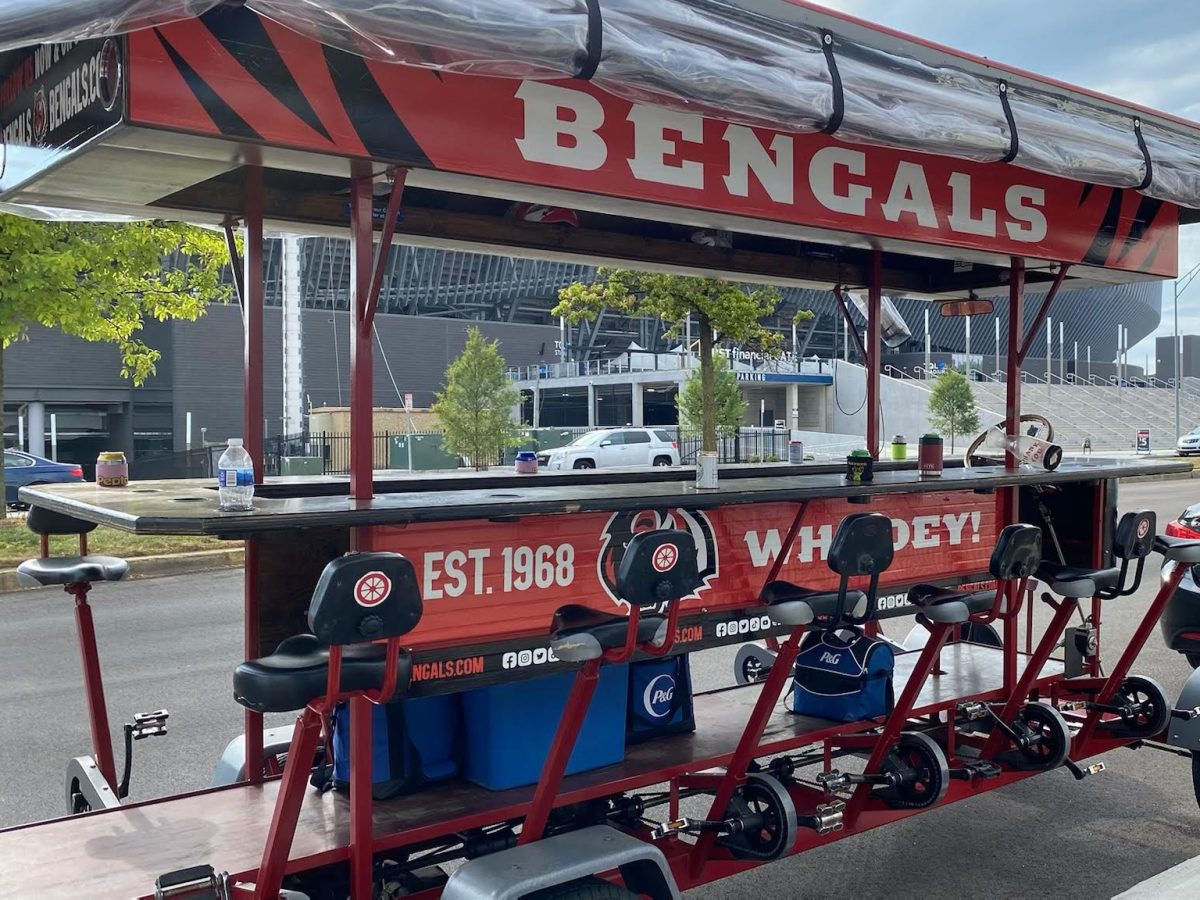 A Pedal Wagon with a Cincinnati Bengals wrap on it- Side View