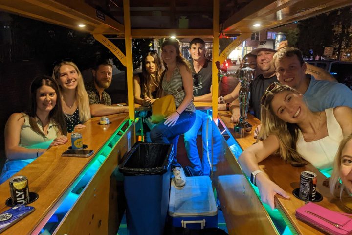 a group of people standing around a table