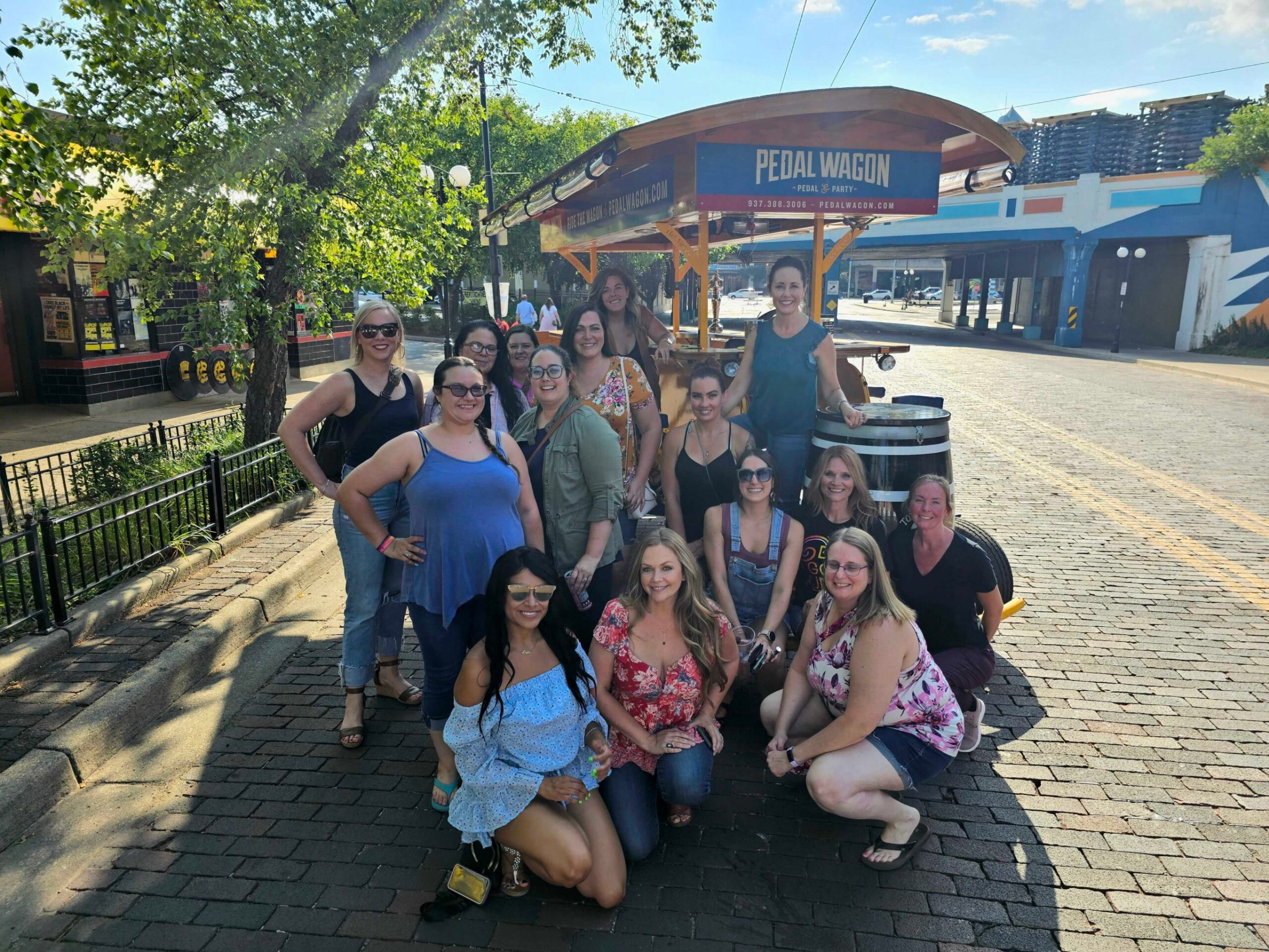 a group of people sitting at a bus stop