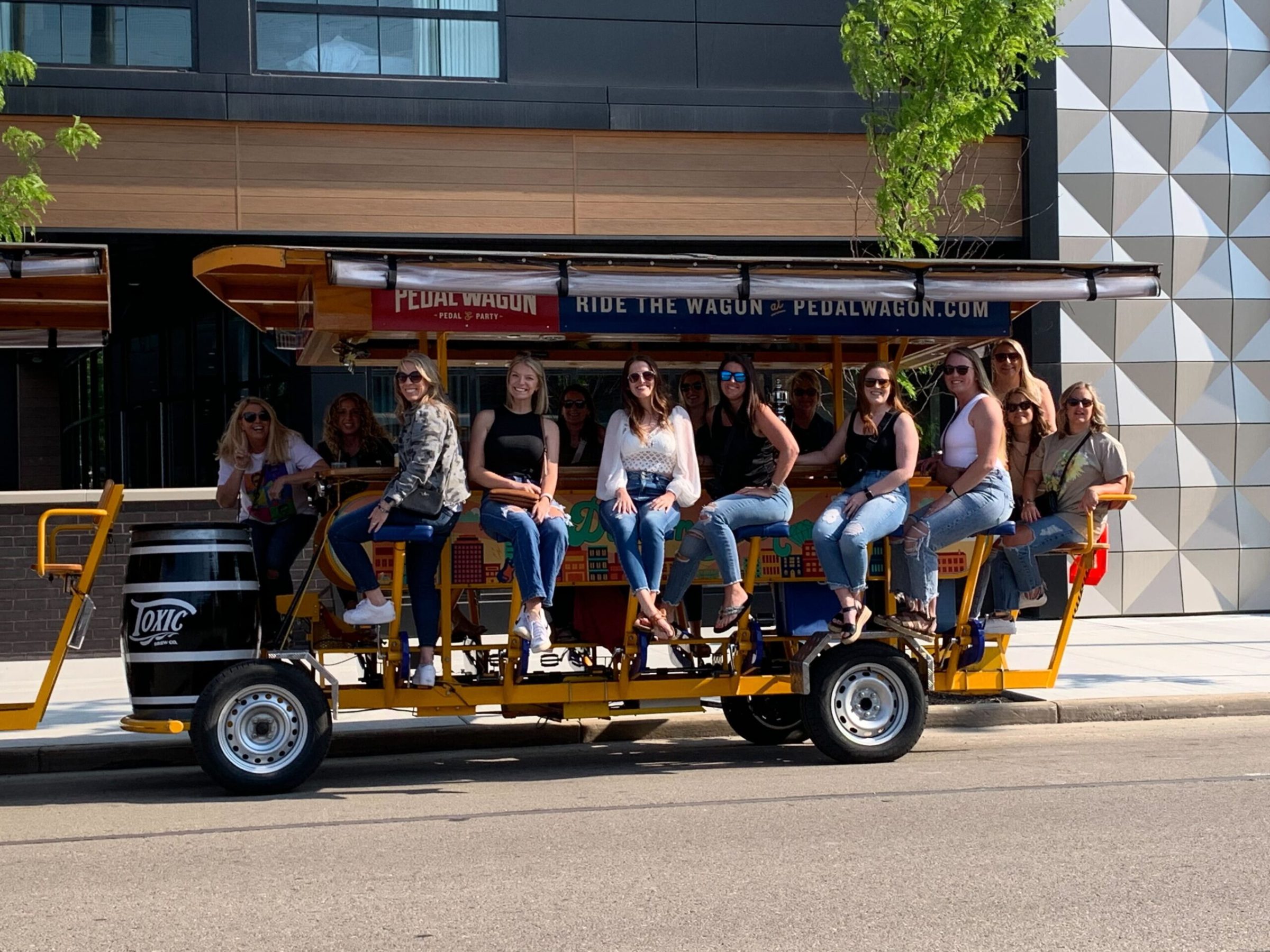 a group of people riding on the back of a truck