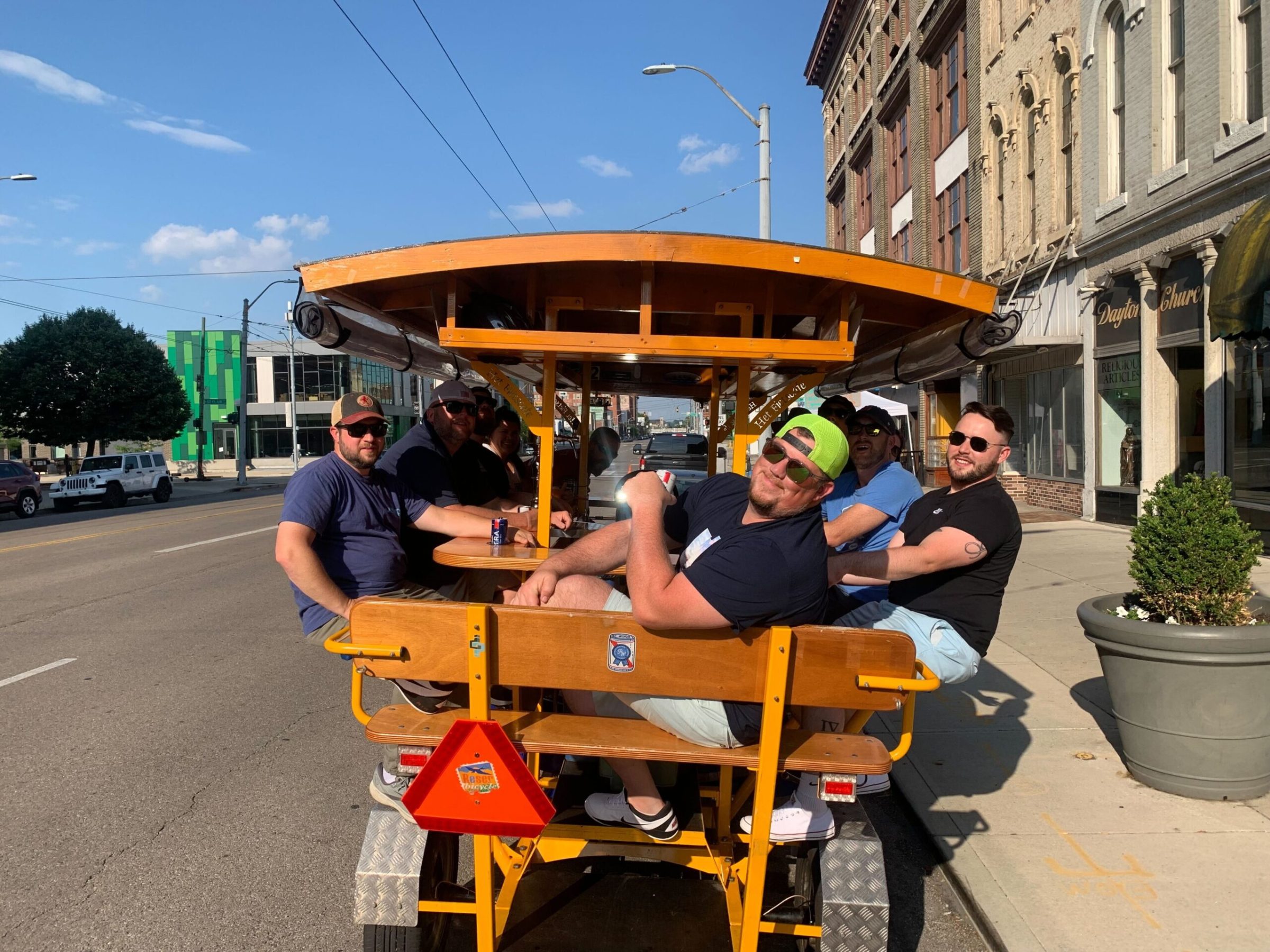 a man and a woman sitting on a cart