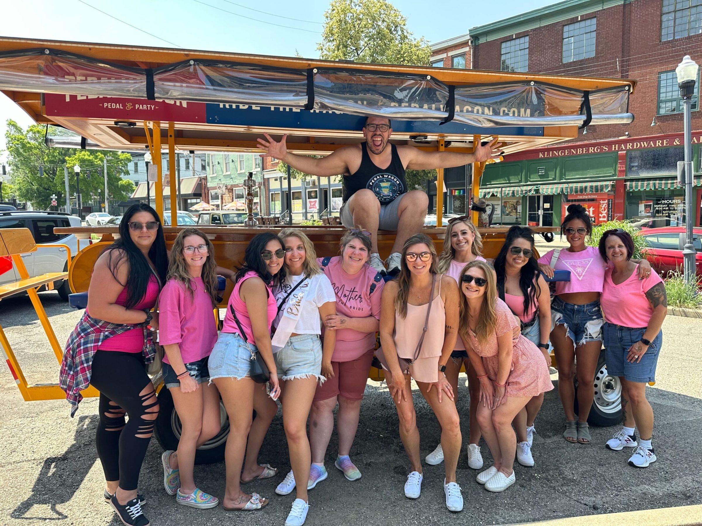 a group of people standing in front of a crowd posing for the camera