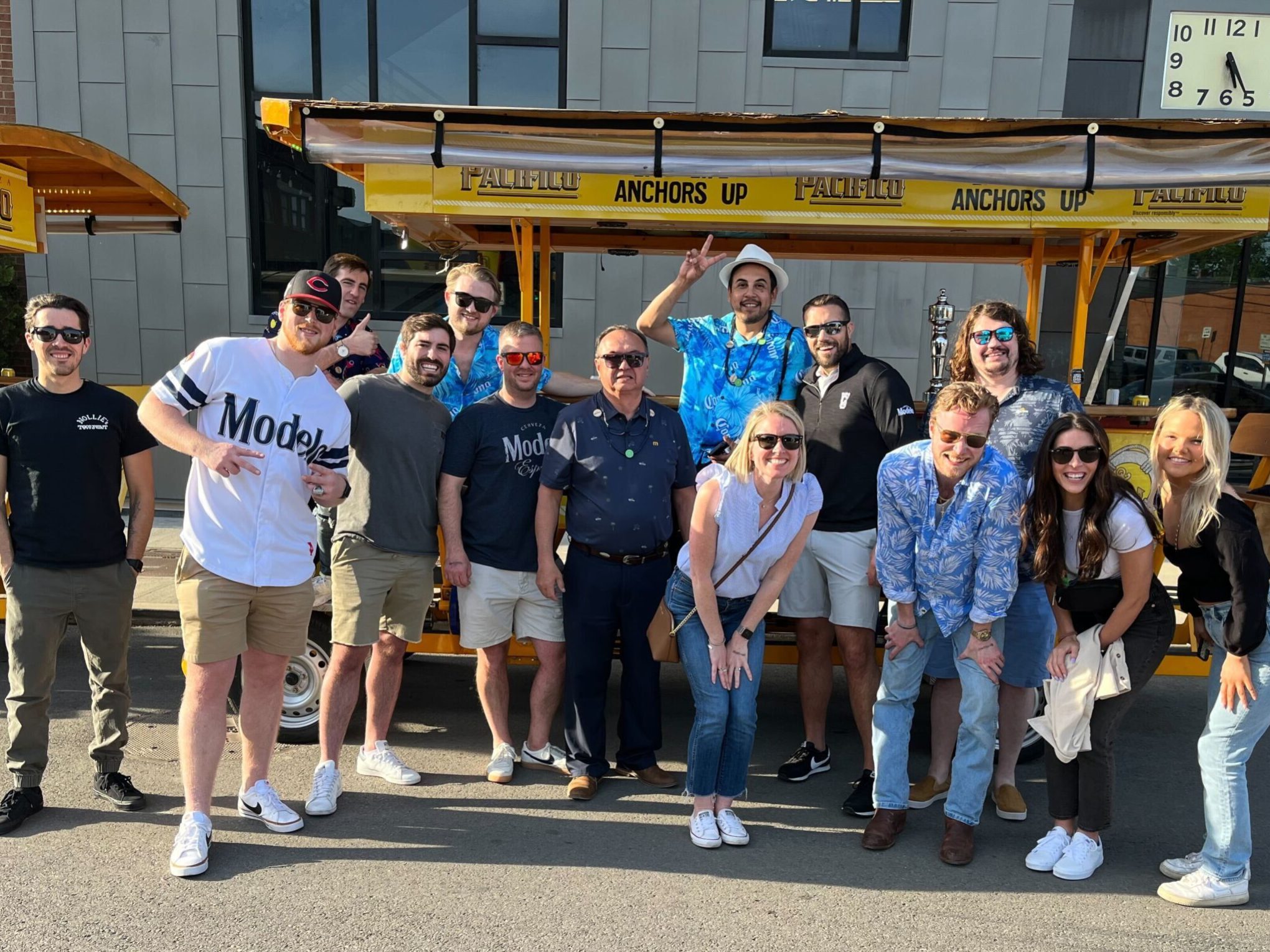 a group of people standing in front of a crowd posing for the camera