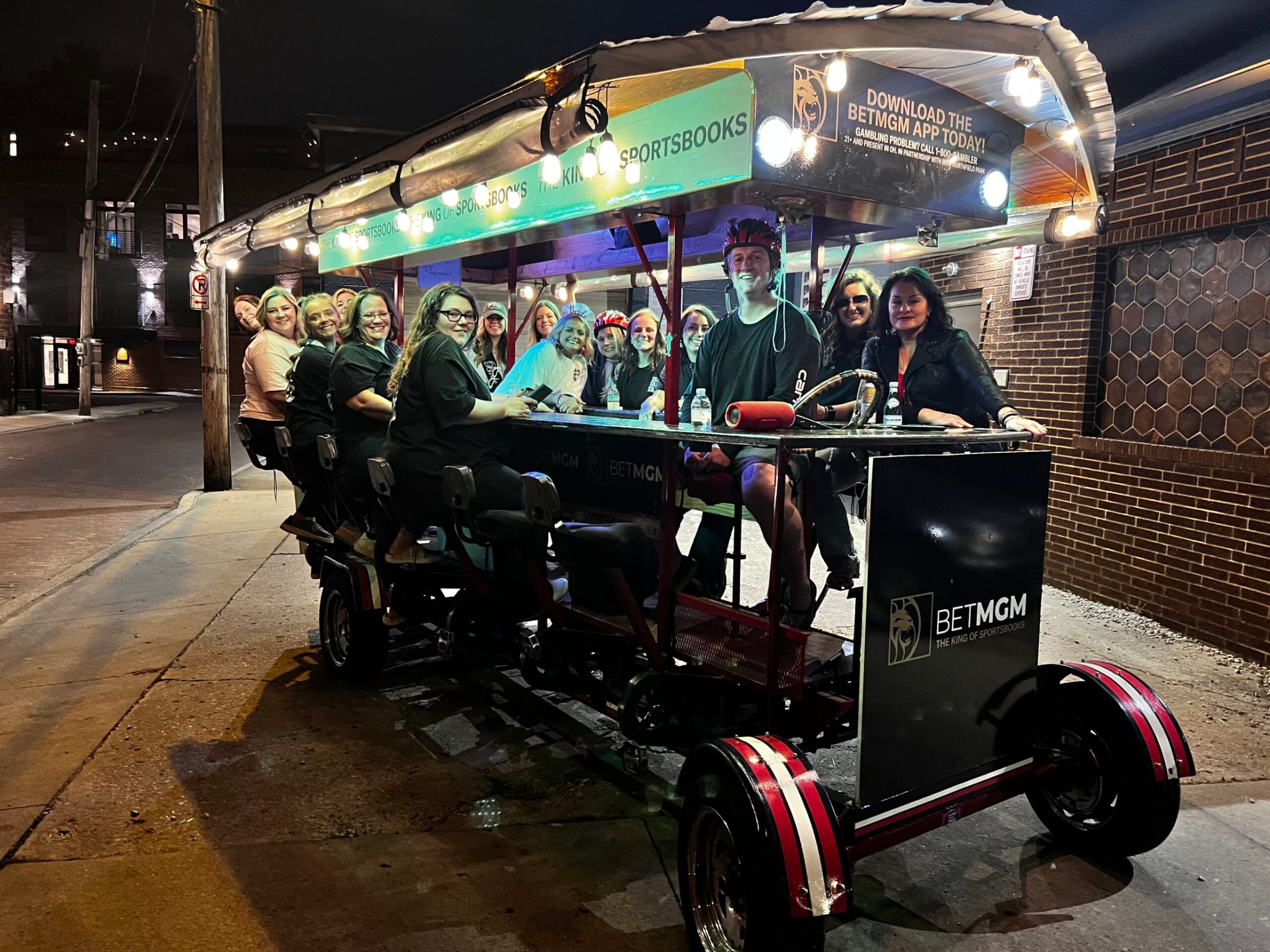 a group of people riding on the back of a truck