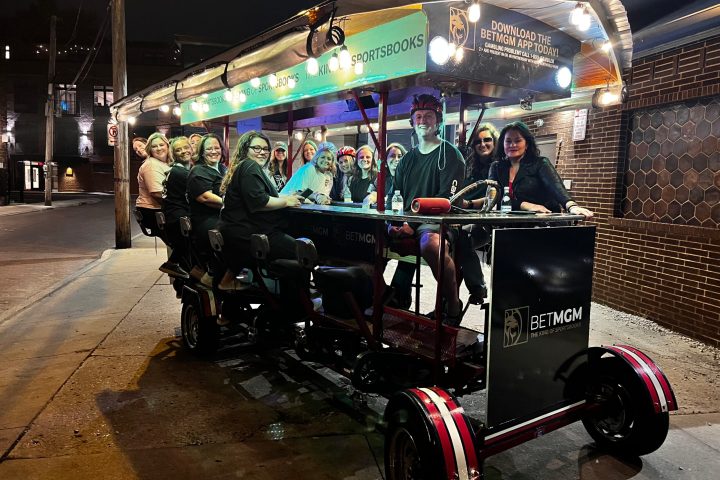 a group of people riding on the back of a truck